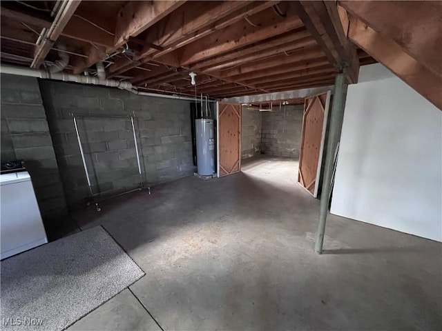 basement with washer / clothes dryer and electric water heater