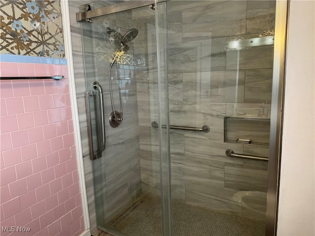 bathroom featuring an enclosed shower