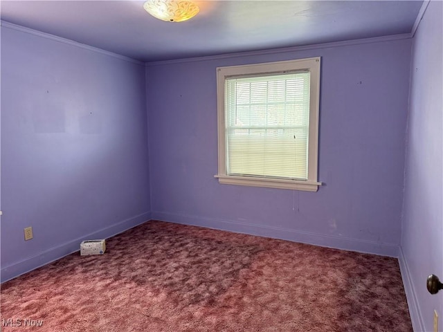 carpeted spare room with ornamental molding