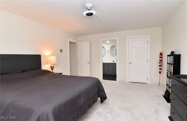 bedroom featuring connected bathroom, ceiling fan, and carpet