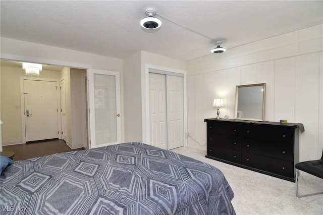 carpeted bedroom with a closet and ceiling fan