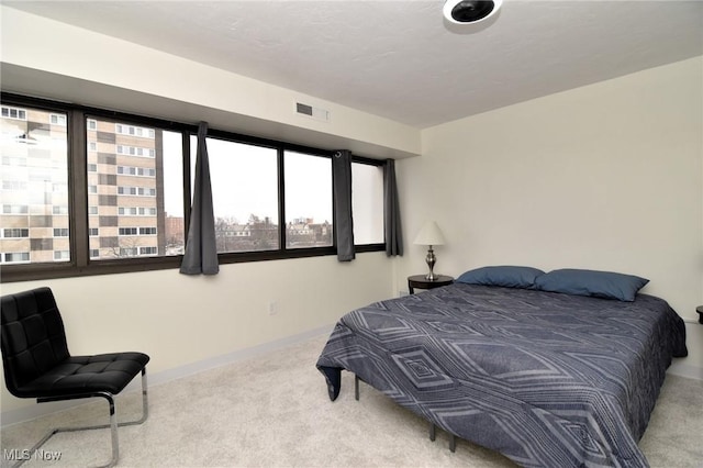 bedroom with light carpet