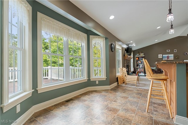 interior space with lofted ceiling and a fireplace