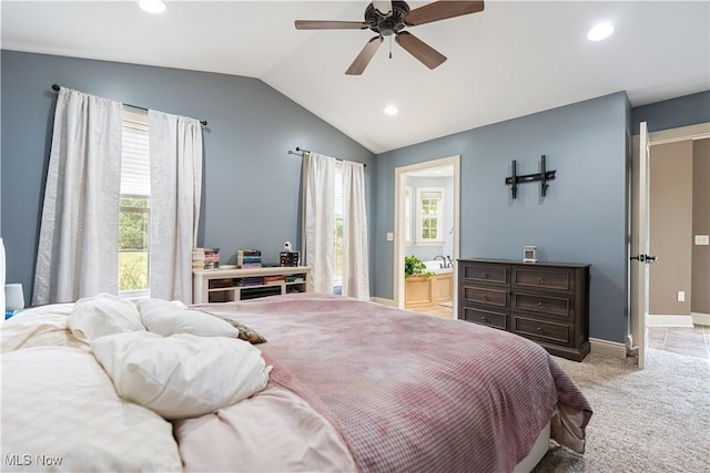 carpeted bedroom featuring ceiling fan, connected bathroom, and vaulted ceiling