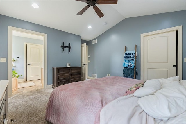 carpeted bedroom featuring ceiling fan and vaulted ceiling