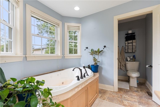 bathroom featuring a bathtub and toilet