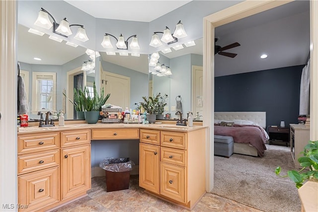 bathroom with ceiling fan and vanity