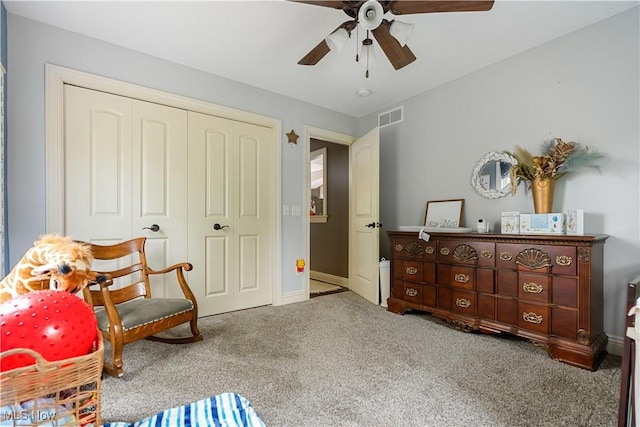 sitting room featuring carpet flooring