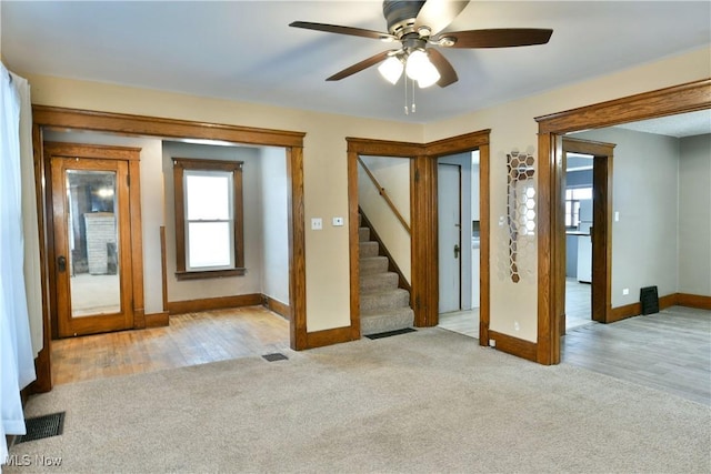 interior space with ceiling fan and light hardwood / wood-style flooring