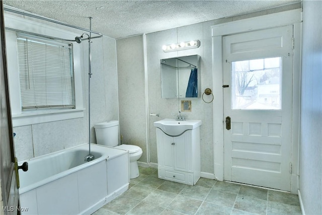 full bathroom with vanity,  shower combination, toilet, and a textured ceiling