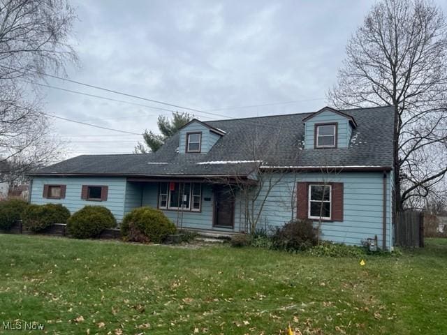 new england style home with a front yard