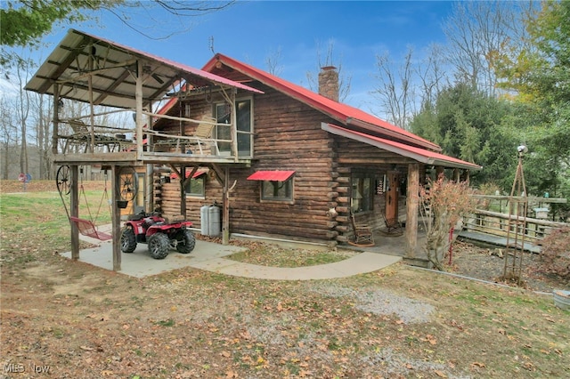 exterior space with a yard and a patio area