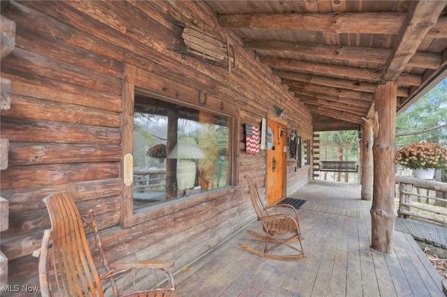 wooden deck featuring covered porch