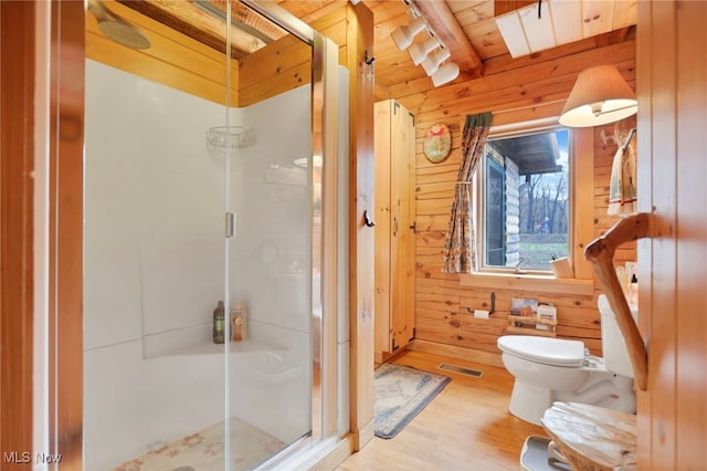 bathroom with wooden walls, a shower with door, wood ceiling, and hardwood / wood-style flooring