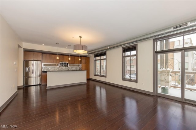 unfurnished living room with dark hardwood / wood-style floors