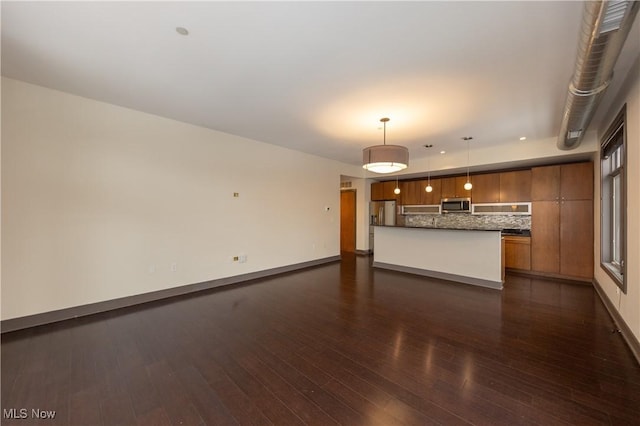 unfurnished living room featuring dark wood-type flooring