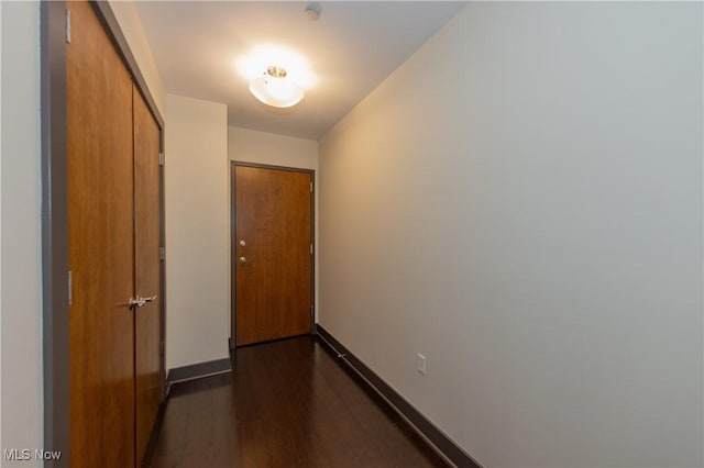 corridor featuring dark hardwood / wood-style floors