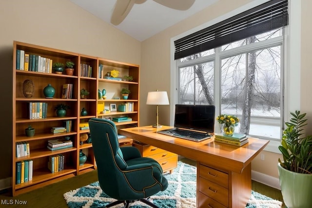 office area featuring ceiling fan, dark hardwood / wood-style floors, and vaulted ceiling