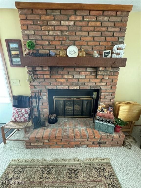 details with carpet floors and a fireplace