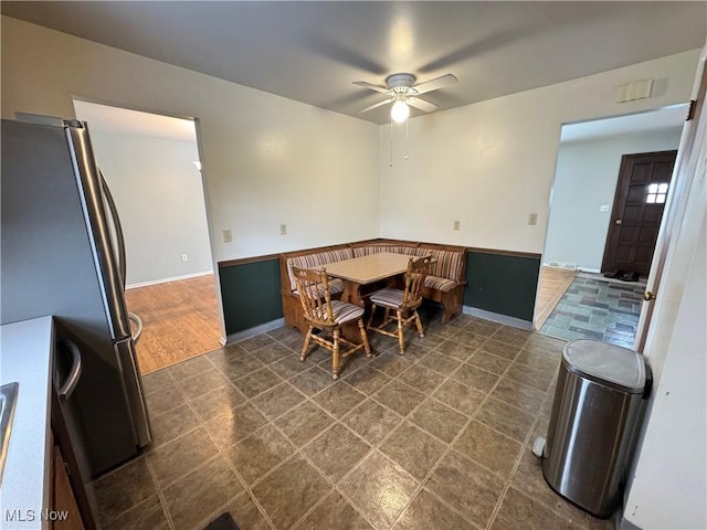 dining space featuring ceiling fan