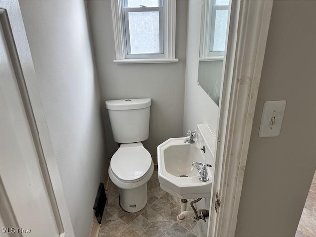 bathroom with toilet and sink