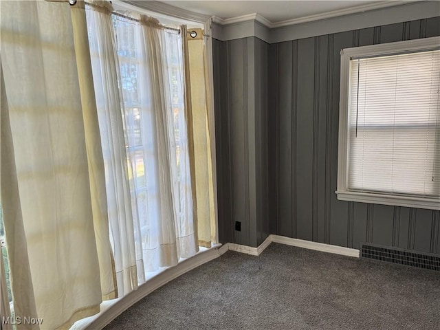 unfurnished room featuring carpet floors and ornamental molding