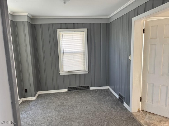 carpeted empty room with ornamental molding