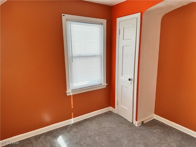 spare room featuring carpet flooring