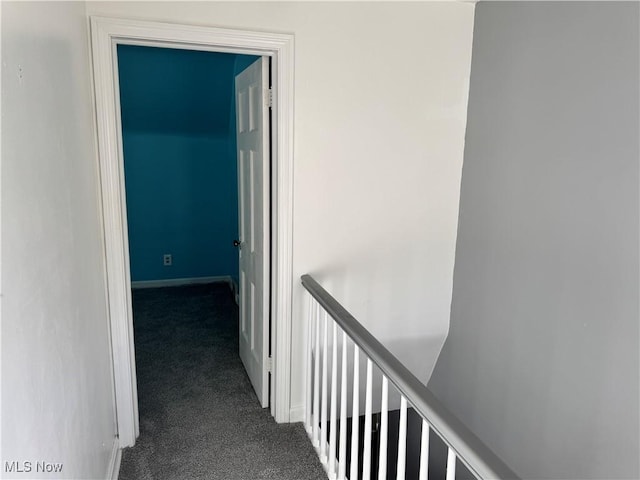 hallway with carpet flooring