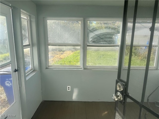 unfurnished sunroom with plenty of natural light