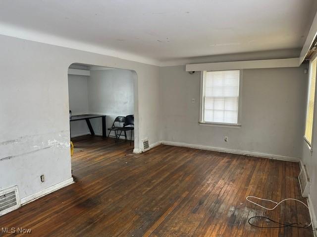 spare room featuring dark hardwood / wood-style flooring