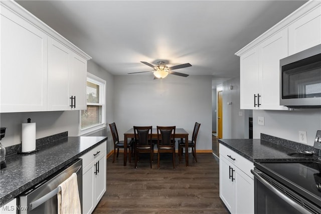 kitchen with white cabinets and appliances with stainless steel finishes