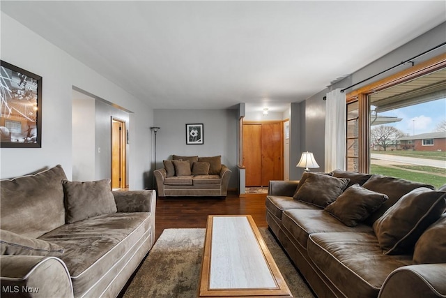 living room with dark wood-type flooring