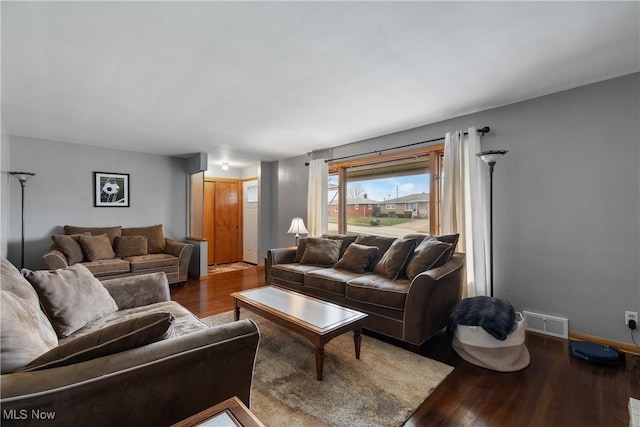 living room with dark hardwood / wood-style floors