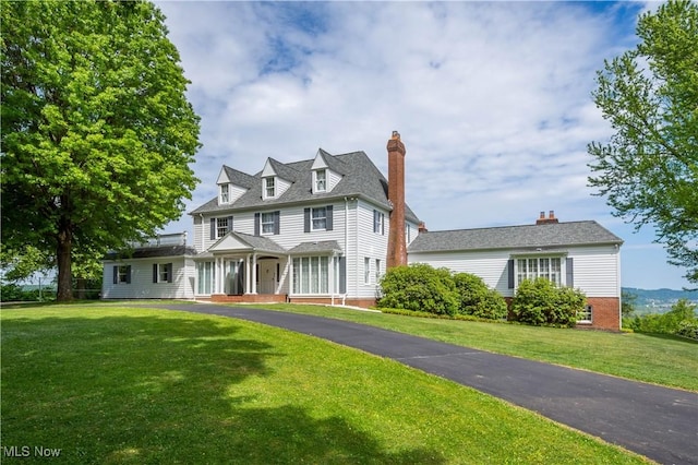 view of front of home with a front yard