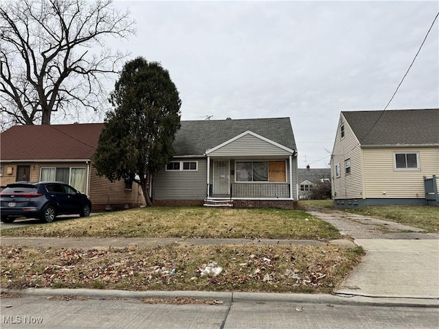 bungalow-style house with a front yard