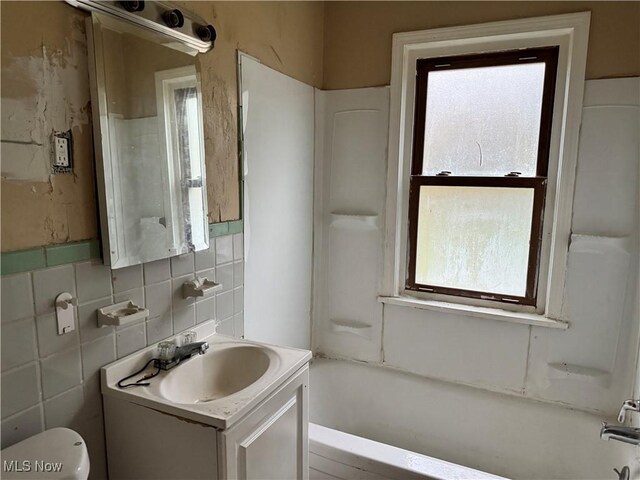 full bathroom with shower / bathing tub combination, vanity, and toilet