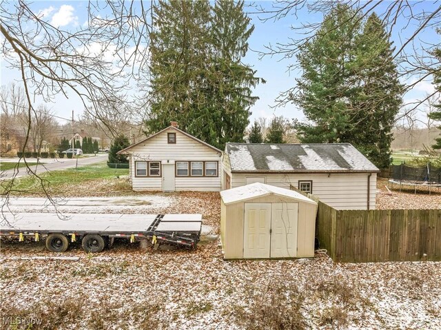 exterior space featuring a storage shed and a trampoline