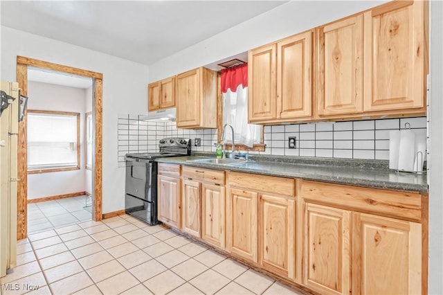 kitchen with backsplash, electric range, sink, and light tile patterned floors