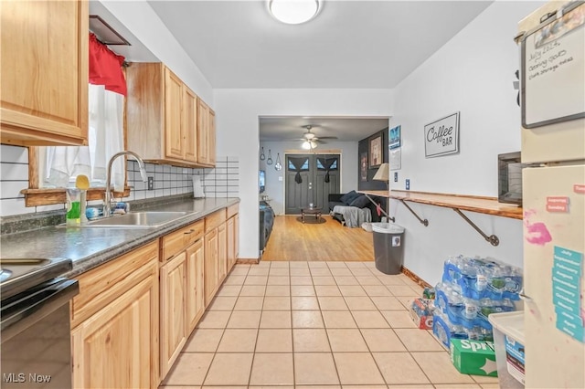 kitchen featuring ceiling fan, sink, light brown cabinets, backsplash, and light tile patterned flooring