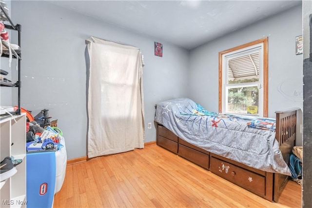 bedroom with wood-type flooring