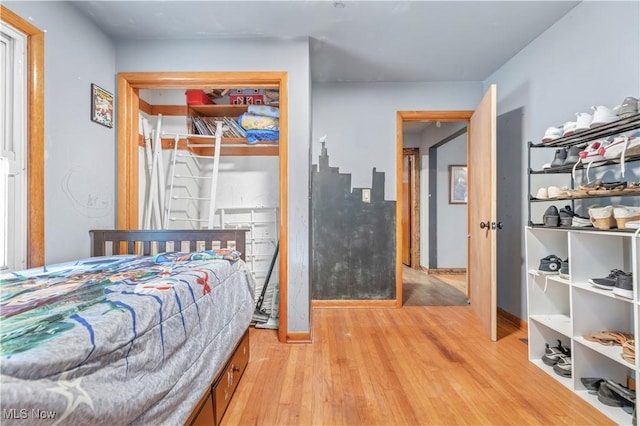 bedroom with hardwood / wood-style floors