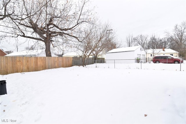 view of yard covered in snow