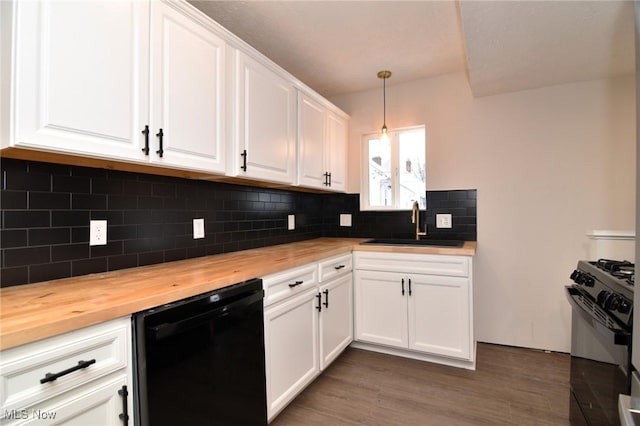 kitchen with white cabinetry, wooden counters, dark hardwood / wood-style floors, decorative light fixtures, and black appliances