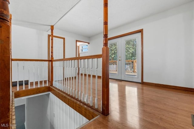 interior space featuring wood-type flooring and french doors