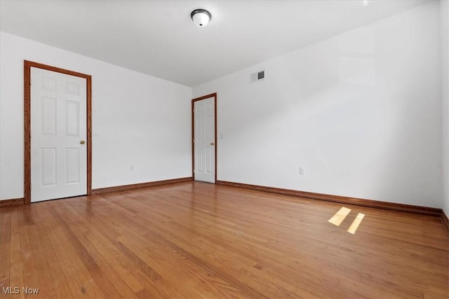 spare room with light wood-type flooring