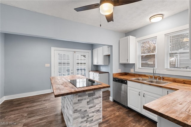 kitchen featuring dishwasher, white cabinets, sink, black electric cooktop, and butcher block countertops