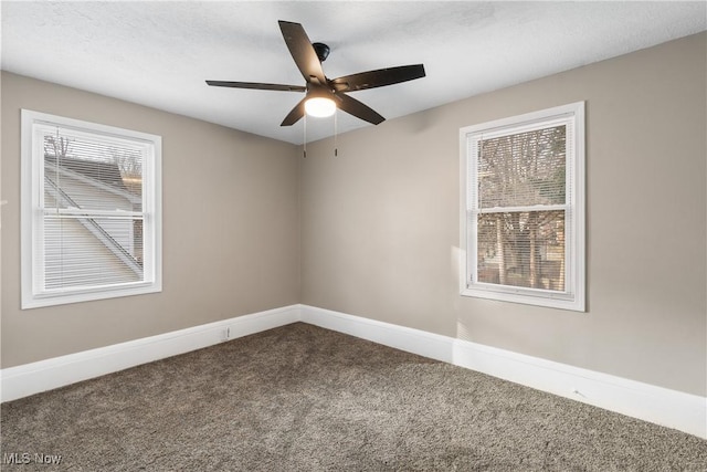 unfurnished room featuring carpet, a textured ceiling, and ceiling fan