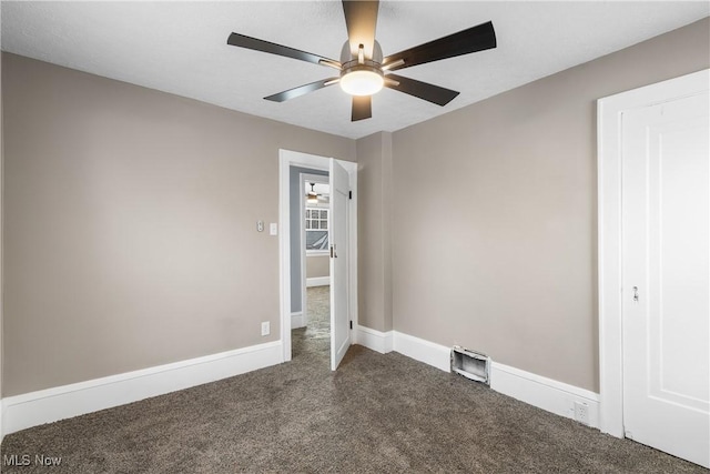 unfurnished bedroom with ceiling fan and carpet