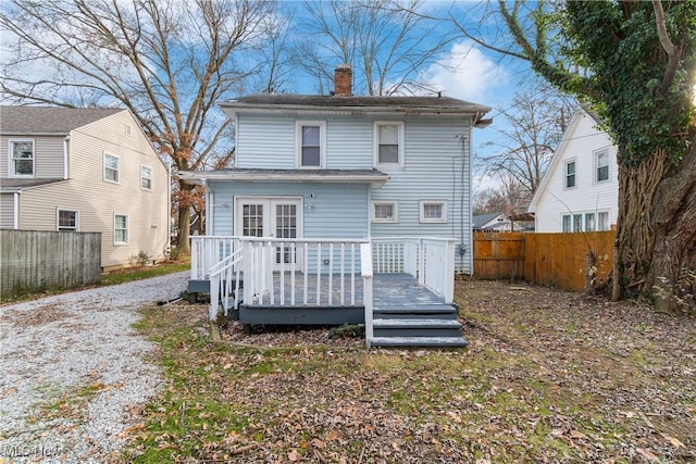 rear view of house featuring a deck